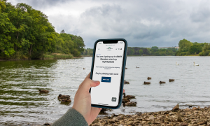 Angler buying a new membership while on the bank.