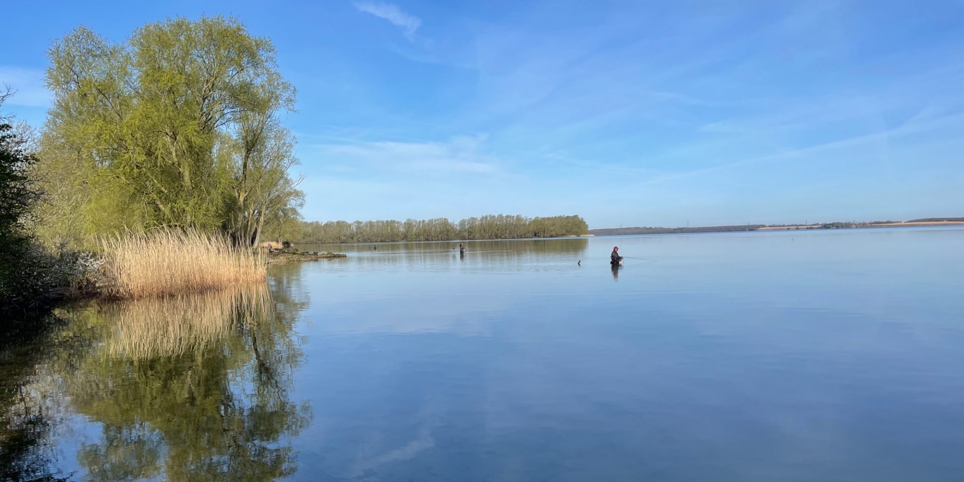 Angler happily fishes on Grafham Water after buying a membership using Clubmate