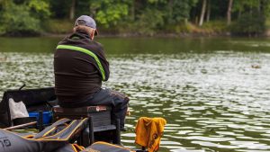 Angler competes in a match at a fishing lake.