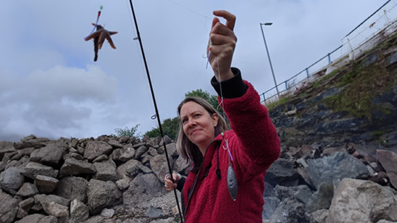 Lorraine holds up a starfish caught at her local rock pool.