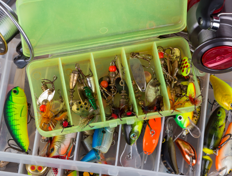 An angler reviews his latest purchases from their nearest fishing tackle shop.