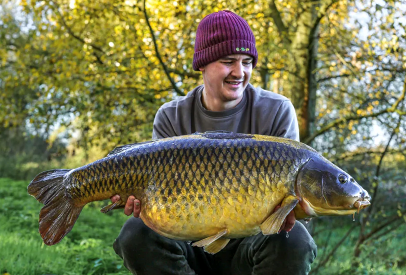 Angler poses with a large carp at SWS Fisheries, one of the most popular fisheries in the South East of England.