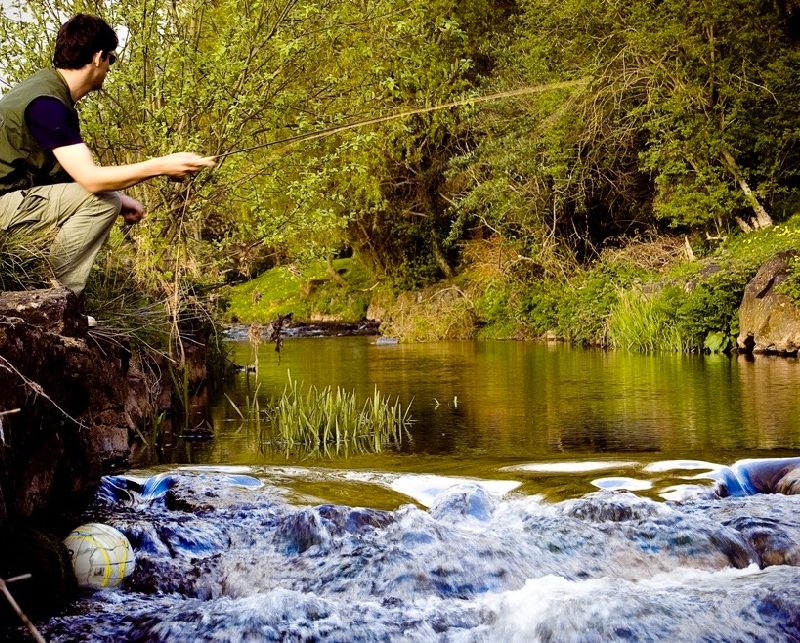 individual angler flyfishing on a river